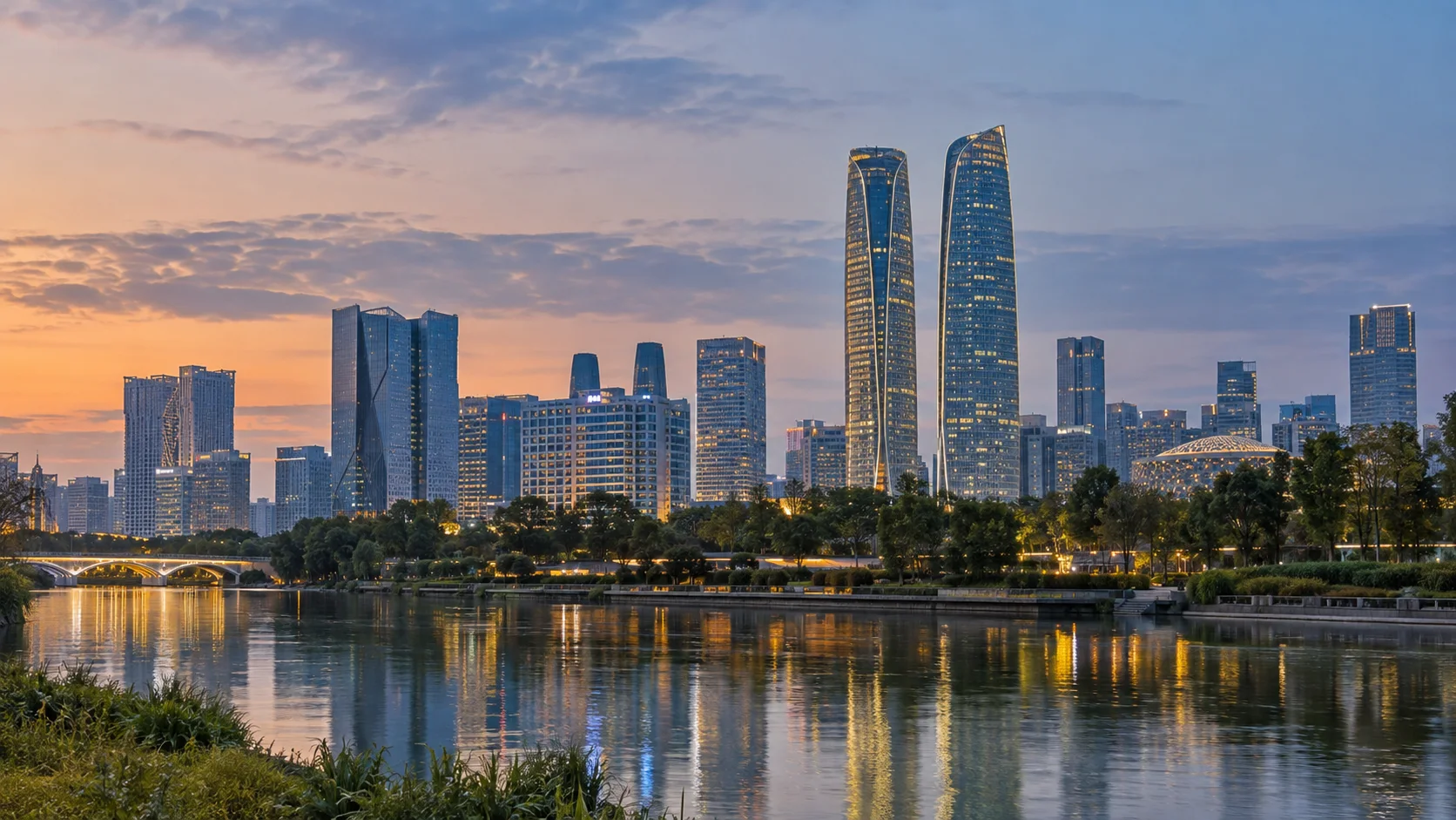 Chengdu skyline across a riverside park at dusk